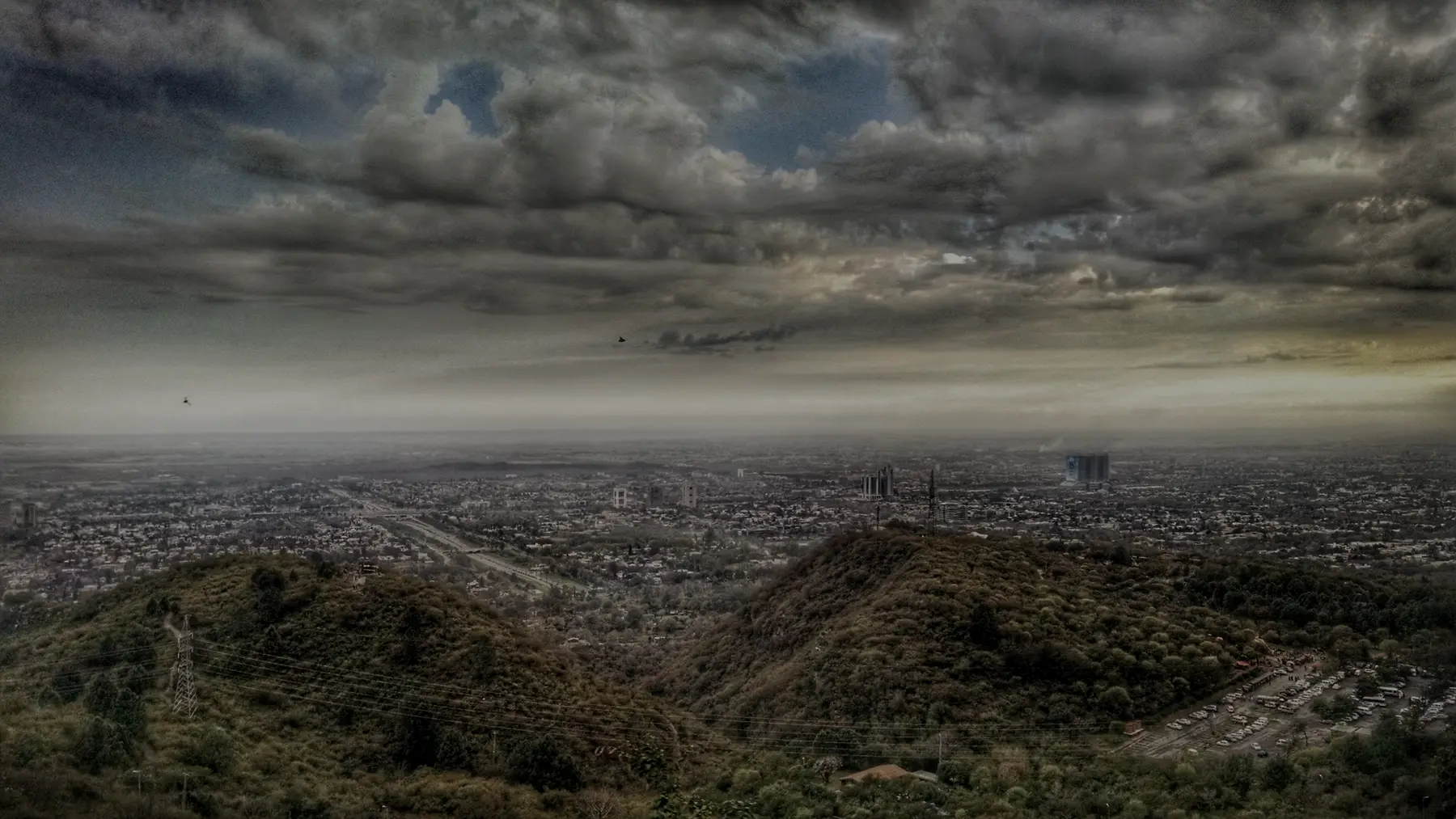 Islamabad at dusk under dark clouds
